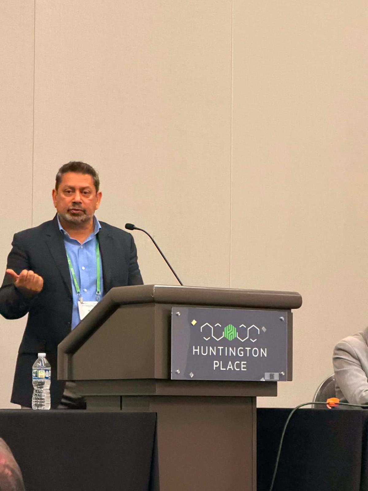 Speaker presenting at a conference